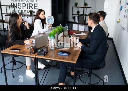 Meeting of young professionals in the office on the topic of business direction and the successful launch of a startup Stock Photo