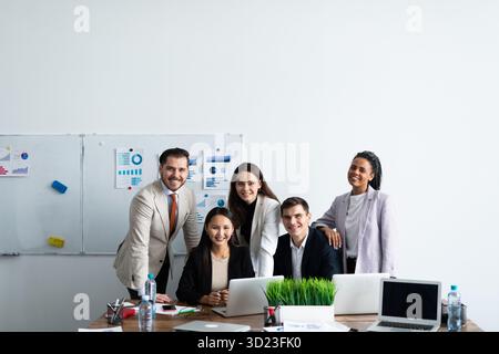 Fun group of young employees in the workplace Stock Photo