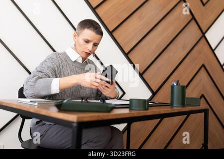 Business woman working in the office at the table Stock Photo