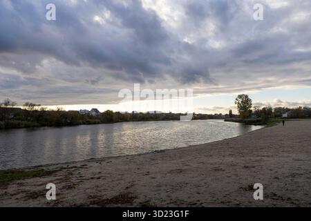 Cloudy sky over the river. Ripples on the water. Stock Photo
