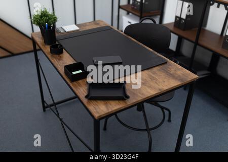 Office desk with office supplies in an empty office Stock Photo