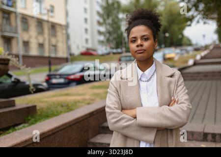 Portrait of successful serious african american businesswoman with arms crossed on chest outside Stock Photo