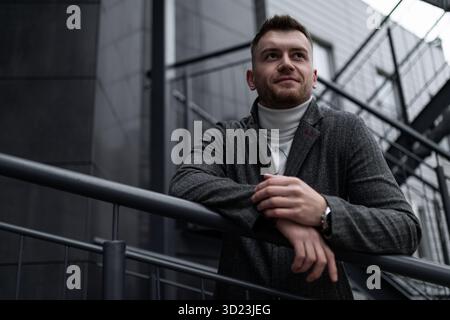 Portrait of a strong brutal young man in Gray tones Stock Photo