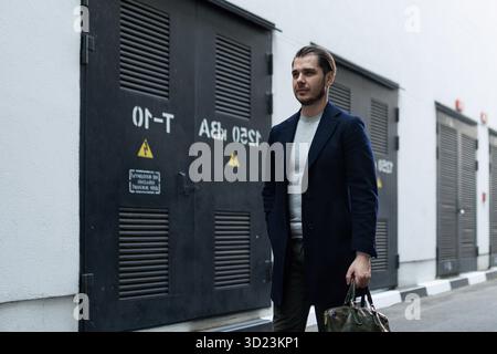 Business man adult caucasian engineer goes to work with a briefcase Stock Photo