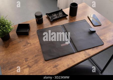 Open leather folder for documents on the desktop Stock Photo