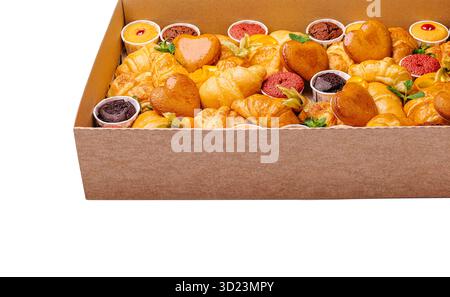 Assorted pastries displayed in a box for a dessert event Stock Photo