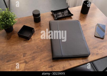 Leather folder for documents on the desktop in brown color Stock Photo