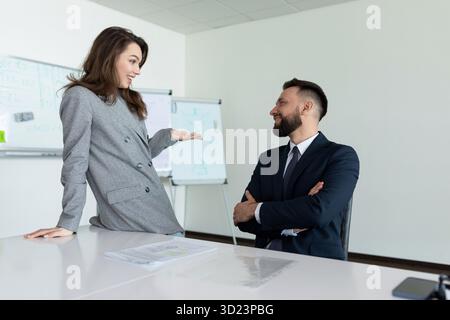 Colleagues during negotiations in the office discuss with each other Stock Photo
