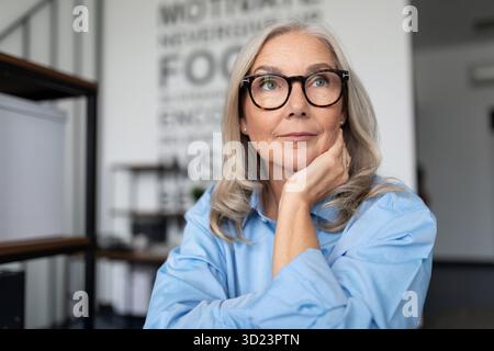 Close-up portrait of a successful business adult mature businesswoman. Accounting Bookkeeper Clerk Woman concept Stock Photo