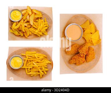 Golden French fries served with creamy dipping sauce on wooden board Stock Photo