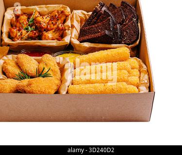 Delicious assortment of crispy appetizers served in a takeout box Stock Photo
