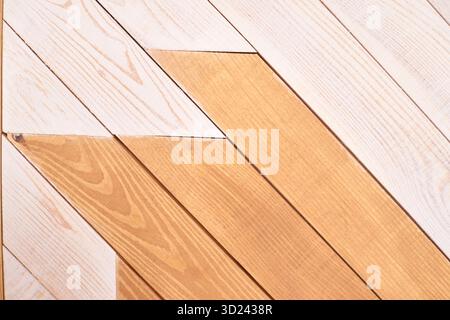 Diagonal wooden planks in light and dark tones forming modern geometric pattern Stock Photo
