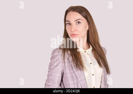 Confident caucasian female professional in plaid blazer with long brown hair Stock Photo