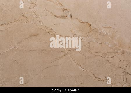 Elegant beige marble surface with subtle veining perfect for various design applications Stock Photo