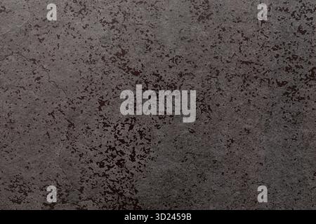 Textured gray concrete surface with subtle patterns and variations in tone captured in natural light Stock Photo