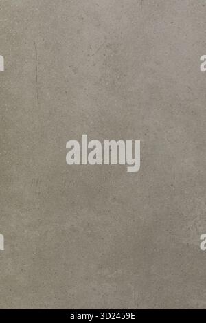 Textured grey wall with subtle variations and light shadows in a minimalist setting Stock Photo