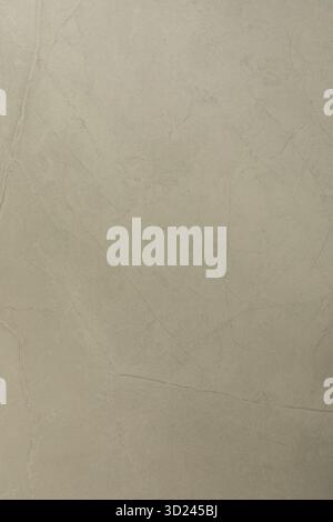 Smooth, light-colored surface with subtle texture and fine lines observed in natural light Stock Photo