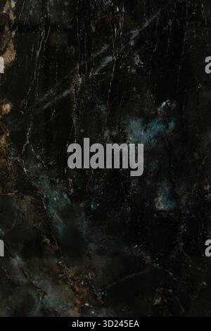 Dark marble surface with subtle blue and gold veining showcasing natural beauty and elegance Stock Photo