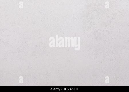 Smooth light gray surface with subtle texture on a neutral background in natural light setting Stock Photo