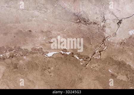 Natural stone texture with intricate patterns and warm tones showcasing beige and brown hues in elegant design Stock Photo