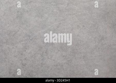 Textured gray surface with subtle patterns and tones ideal for backgrounds in various projects Stock Photo