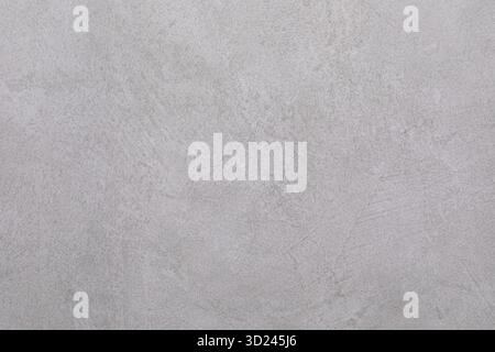 Concrete surface with a subtle texture showing a light gray tone, perfect for modern aesthetic designs and backgrounds Stock Photo