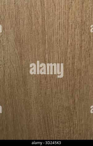 Wooden texture showing intricate grain patterns and natural tones in a warm light setting Stock Photo