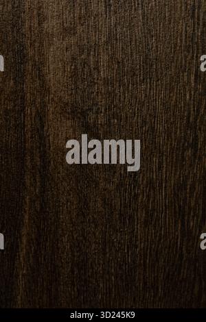 Dark wooden texture showcasing natural grain patterns and rich hues in a close-up view Stock Photo