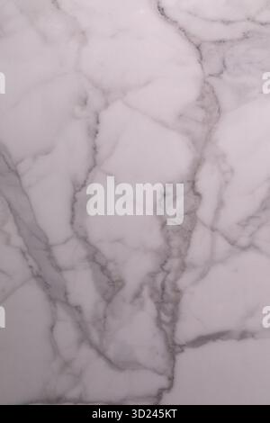 Beautiful white marble surface with natural grey veining in a polished finish Stock Photo