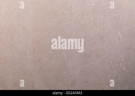Elegant beige marble surface with subtle texture viewed in natural light Stock Photo