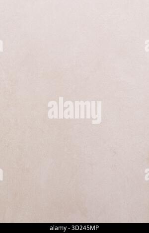 Smooth light beige plaster wall texture with subtle variations in tone and color Stock Photo