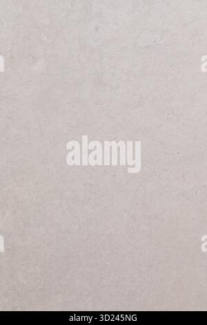Textured white wall surface with subtle variations in color and pattern during daytime light Stock Photo