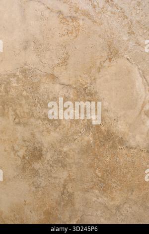 Surface texture showcasing warm beige and light brown tones with natural patterns in a stone material Stock Photo