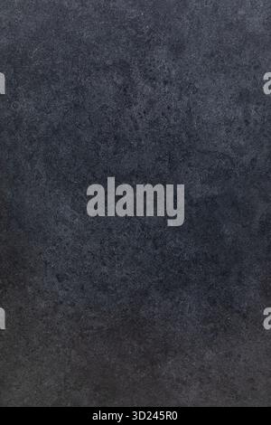 Dark textured surface showing a subtle pattern ideal for creative backgrounds and designs in various projects Stock Photo