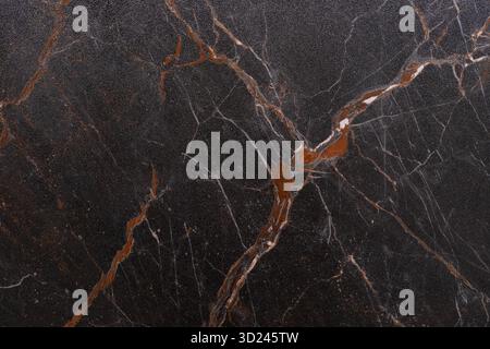 Dark marble with white and brown veins showcasing natural beauty and elegance in a modern design Stock Photo