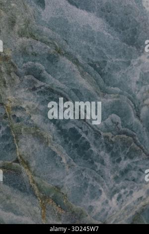 Beautiful close-up of blue marble showing intricate patterns and textures in natural stone formation Stock Photo