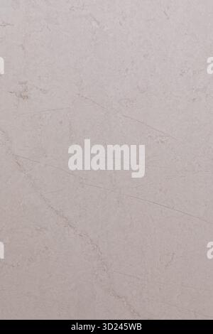 White textured wall with subtle variations in color and pattern creates a serene and minimalist backdrop for various designs Stock Photo