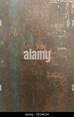 Rustic metal surface with texture and color variation showing signs of age and patina in a close-up view Stock Photo