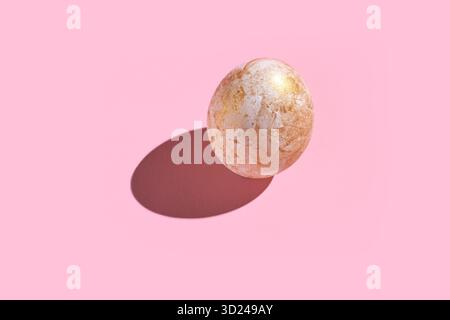 Golden marble stone with shadow on pastel pink background Stock Photo