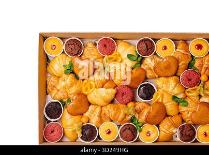 Assorted pastries and desserts displayed in a decorative box for celebrations Stock Photo