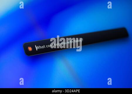 Poznan, Poland - September 18, 2025: Digital screen shows interactive AI query bar 'What can I help you with today' offering immediate responsive clie Stock Photo