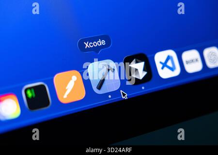 Poznan, Poland - September 18, 2025: Xcode, Apple's integrated development environment, highlighted on a blue computer screen dock, for modern softwar Stock Photo