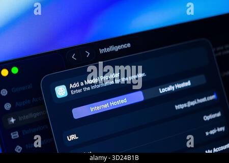 Poznan, Poland - September 18, 2025: Computer screen showcasing a dark user interface for Intelligence settings, configuring internet hosted AI model Stock Photo