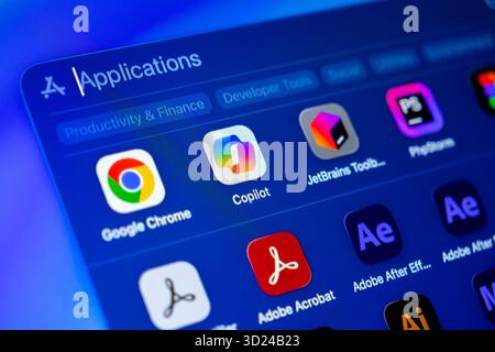 Poznan, Poland - September 18, 2025: Copilot app icon on illuminated screen, symbolizing AI-driven programming, innovative tech solutions and efficien Stock Photo