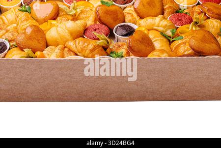 Assorted pastries displayed in a box for a dessert event Stock Photo