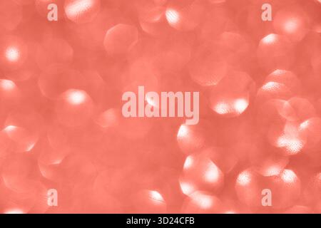 Coral pink bokeh background with circular light patterns and soft abstract Stock Photo