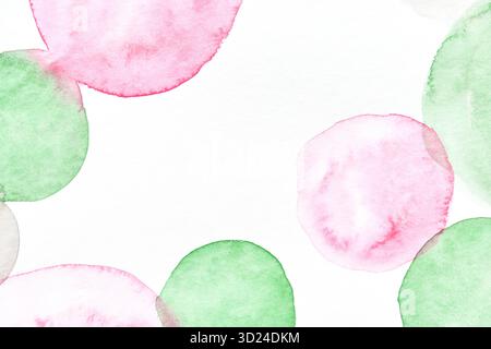 Abstract watercolor artwork with pink and green circular shapes on white Stock Photo