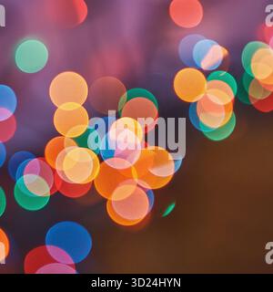 Colorful bokeh lights in soft focus creating vibrant abstract background Stock Photo