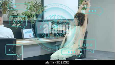 Floating circular AI holographic interface displaying patterns in office, with monitors and plants Stock Photo