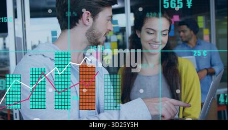 Collaborating two coworkers reviewing data overlays on laptop at modern office, with sticky notes Stock Photo
